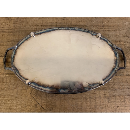 78 - A large silver plated gallery tray with inscription to centre '21 Years Service from the Staff of Wo... 