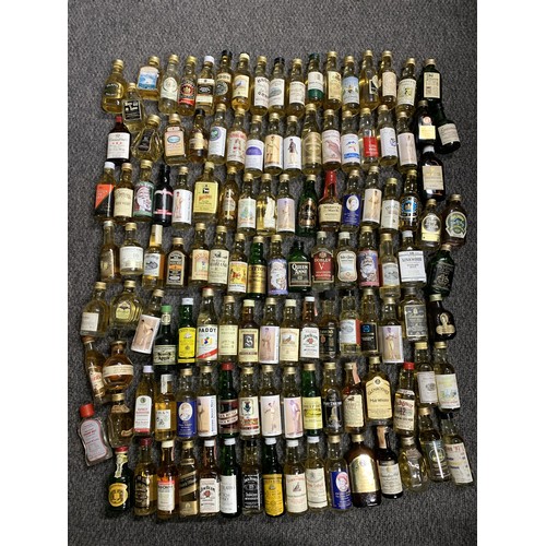 52 - A good large selection of whisky miniatures, mainly Scottish but includes American bourbon and whisk... 