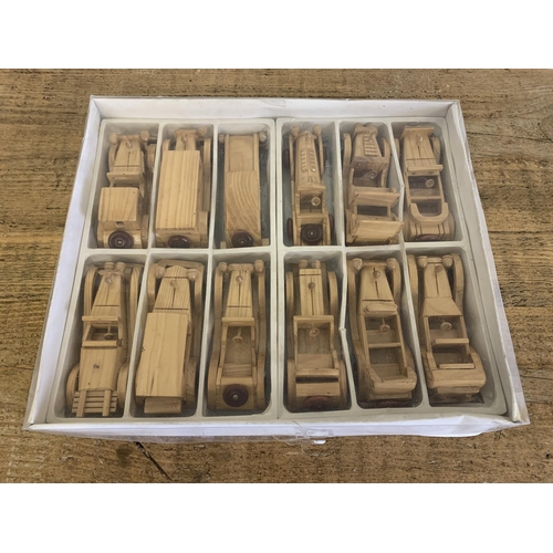 308 - A mixed lot of wooden cars, twelve in total plus an Indian knife and fork carving set