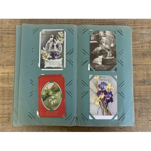 10 - An Art Nouveau period postcard album, well filled with local and topographical postcards plus some l... 