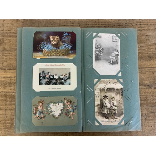 10 - An Art Nouveau period postcard album, well filled with local and topographical postcards plus some l... 