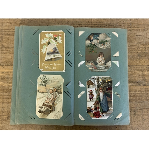 10 - An Art Nouveau period postcard album, well filled with local and topographical postcards plus some l... 