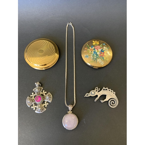 101 - Two vintage powder compacts plus a 'Jewelcraft' white metal chameleon, a stone set cross and a white... 