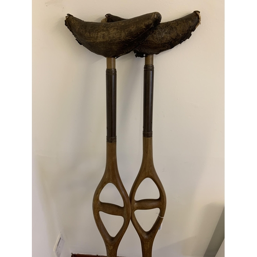 119 - A pair of antique crutches, 50