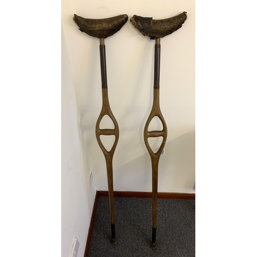 119 - A pair of antique crutches, 50