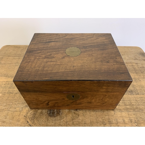 12 - A small antique mahogany writing slope/box inset with a brass cartouche and lock (no key), 10