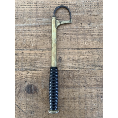 147 - A 19th Century brass pike fishing gaff (handle cracked)