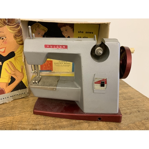 162 - A vintage Vulcan Classic child's electric sewing machine, battery driven in original box (signs of a... 