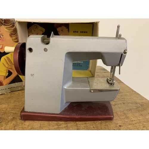 162 - A vintage Vulcan Classic child's electric sewing machine, battery driven in original box (signs of a... 