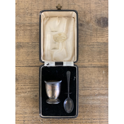 288 - A boxed hallmarked silver egg cup and spoon, Birmingham 1935 with additional Jubilee mark plus a pos... 