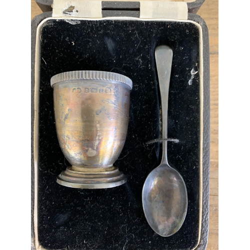 288 - A boxed hallmarked silver egg cup and spoon, Birmingham 1935 with additional Jubilee mark plus a pos... 