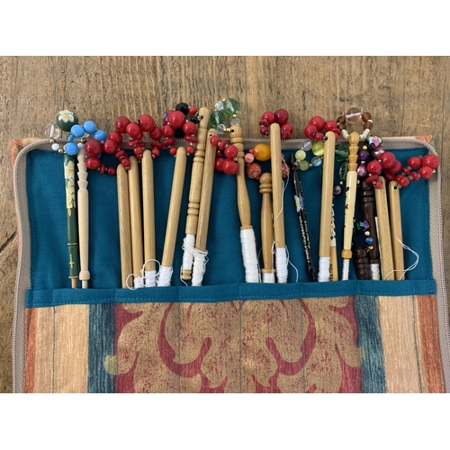 34 - Approx. 38 decorative lace bobbins, some hand painted