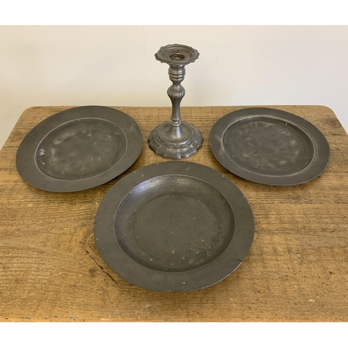 4 - Two antique pewter plates, one with touch marks for London plus a pewter dish and later candlestick