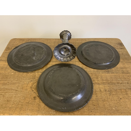 4 - Two antique pewter plates, one with touch marks for London plus a pewter dish and later candlestick