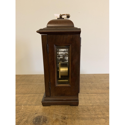 51 - A mahogany case mantel clock with key, marked for Garrard & Co Ltd with dedication, undated presenta... 