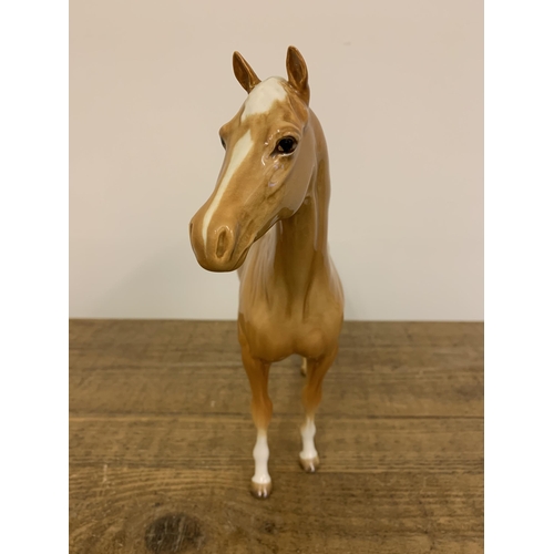 57 - A large Beswick Palomino horse figurine, approx. 11 3/4