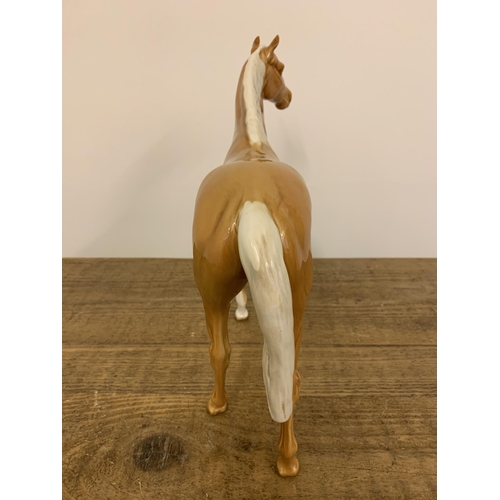 57 - A large Beswick Palomino horse figurine, approx. 11 3/4