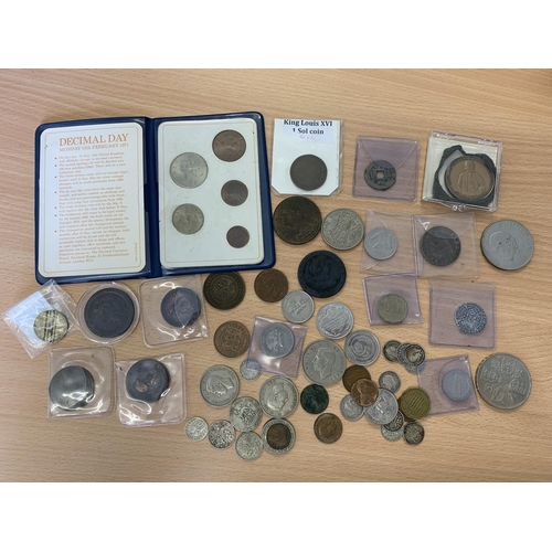 130 - A metal cashbox (no key) and coin contents, British and world, various dates, noted is a copy of Hen... 