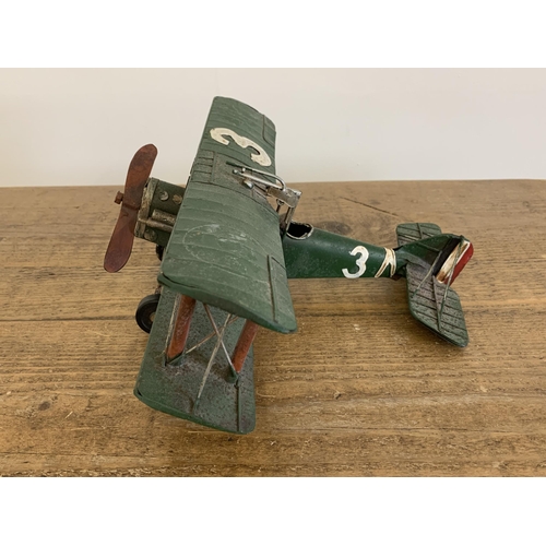 15 - A vintage tin plate bi-plane, approx. 10