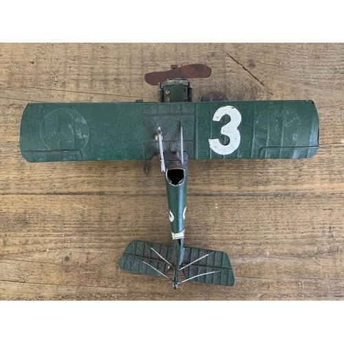 15 - A vintage tin plate bi-plane, approx. 10