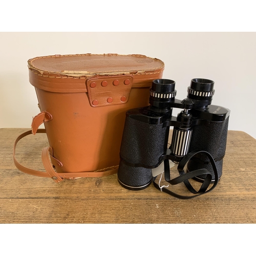 162 - Cased 'Leisure Arts' 12x50 binoculars with clear optics (strap as found)