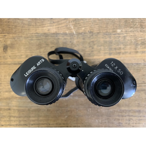 162 - Cased 'Leisure Arts' 12x50 binoculars with clear optics (strap as found)