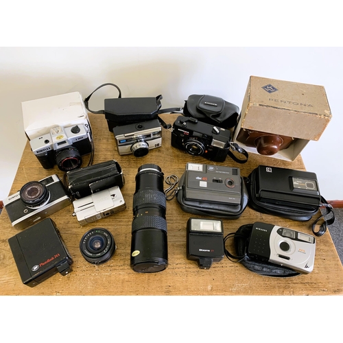 181 - A mixed lot of vintage cameras and lenses to include an Olympus Trip 35