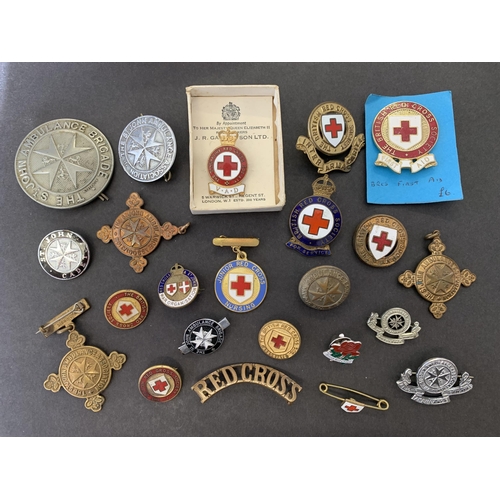 185 - A selection of vintage Red Cross, St John Ambulance,  VAD etc badges and medallions