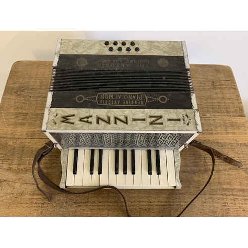 203 - A cased 'Mazzini Saxony Genuine Antoria Piano Action' accordion (not tested)