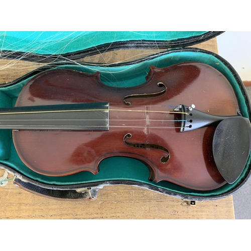 205 - A vintage cased 'Lark' violin, made in Shanghai China