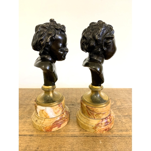 215 - After Claude Michel 'Clodion', a pair of bronze busts on marble bases, marked 'Clodion' to the backs... 