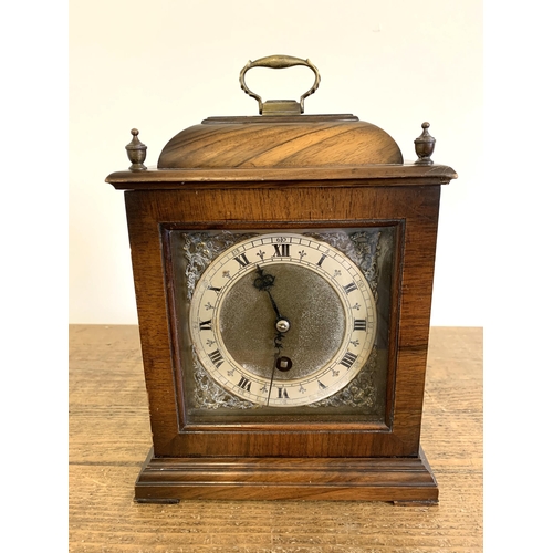 218 - A vintage mahogany cased key wind mantel clock, no obvious maker, brass handle and corner decoration... 