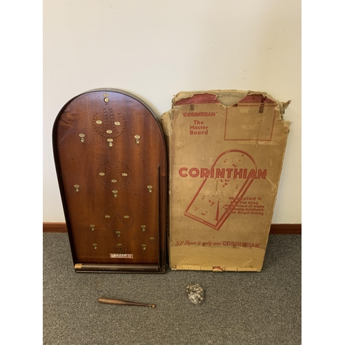 219 - A boxed vintage Corinthian 21T bagatelle board with pusher and ball bearings