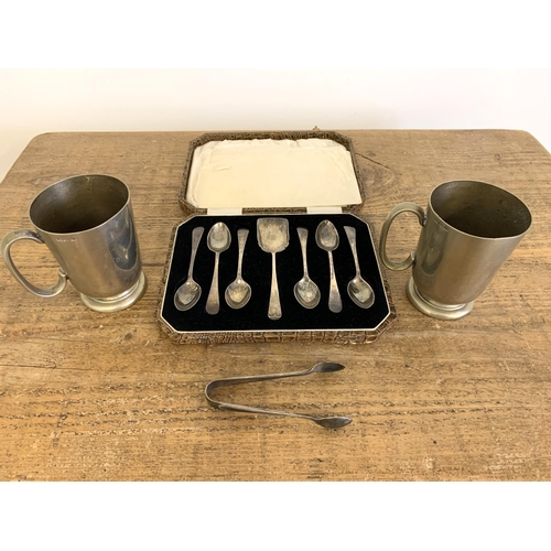 226 - A cased set of silver plated teaspoons with sugar spoon plus two plated cups and tongs