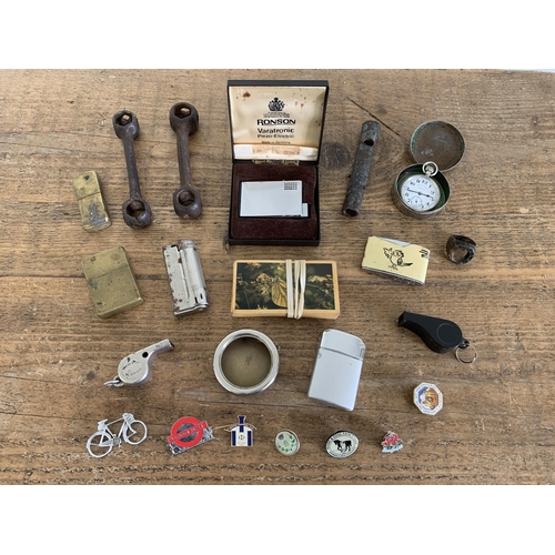 232 - A small group of items including vintage lighters, small pocket watch (non running), badges etc