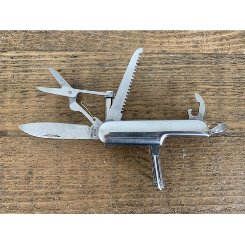 235 - A multitool pocket penknife including a small light/torch