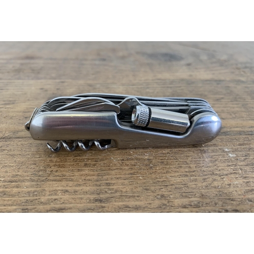 235 - A multitool pocket penknife including a small light/torch