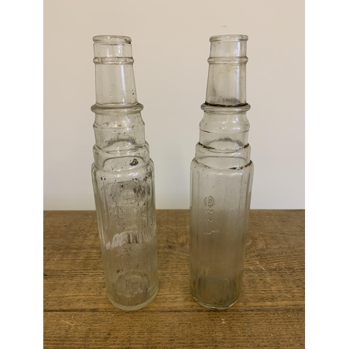 24 - Two vintage Esso glass oil bottles, 12