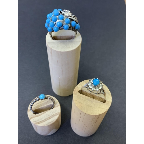 241 - Three white metal and turquoise stone set rings, all three approx. size R