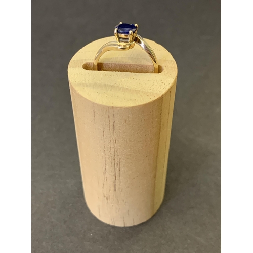 246 - A yellow metal and sapphire set ring (marks rubbed, but '85' visible), approx. size J, weight approx... 