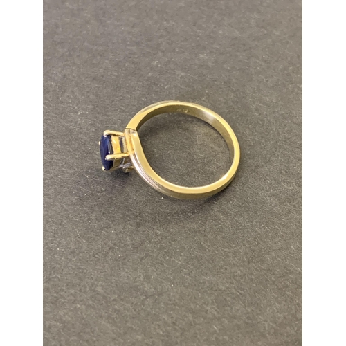 246 - A yellow metal and sapphire set ring (marks rubbed, but '85' visible), approx. size J, weight approx... 