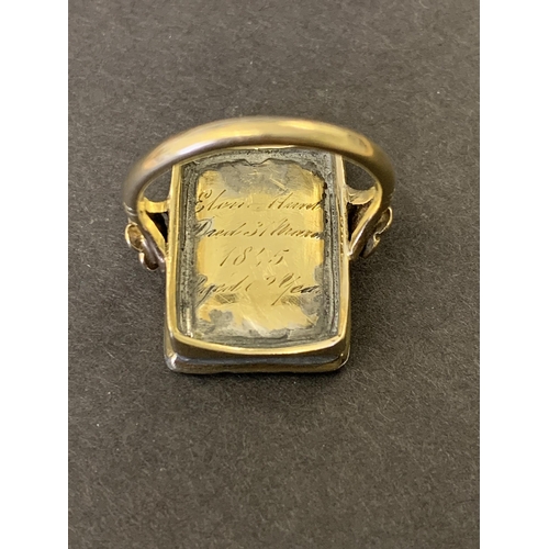 249 - An unusual 9ct gold shank Victorian mourning ring, the top section with preserved hair in an ornate ... 