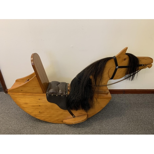 273 - A vintage pine rocking horse with horsehair mane and leather seat, approx. 49