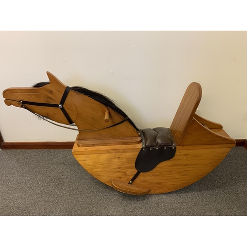 273 - A vintage pine rocking horse with horsehair mane and leather seat, approx. 49