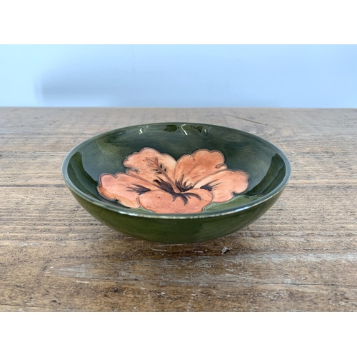 276 - A Moorcroft hibiscus pattern dish with paper label to base, approx. 5 1/2