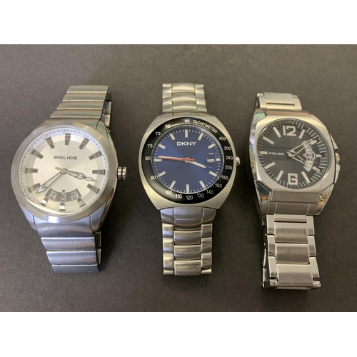 329 - Two Police designer gents wristwatches plus a DKNY designer gents wristwatch (all running at the tim... 