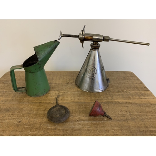 335 - A vintage Redex Additive dispenser with a green pint oil can and two small oil cans