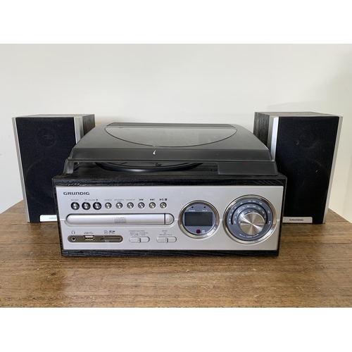 347 - A Grundig CURPA3 mini compact stereo system, turntable, CD player and radio with speakers (lid as fo... 