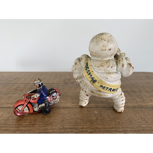 35 - A vintage cast metal Michelin Man, approx. 5 1/2