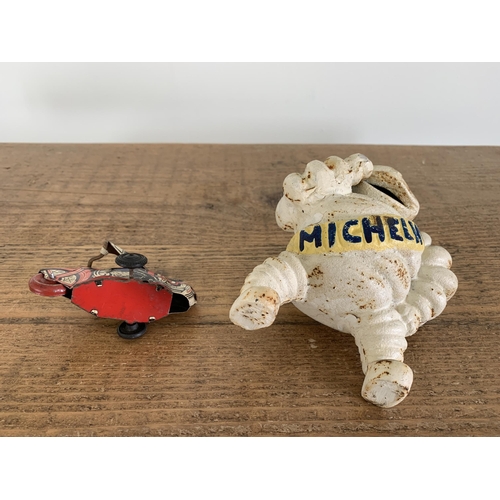 35 - A vintage cast metal Michelin Man, approx. 5 1/2